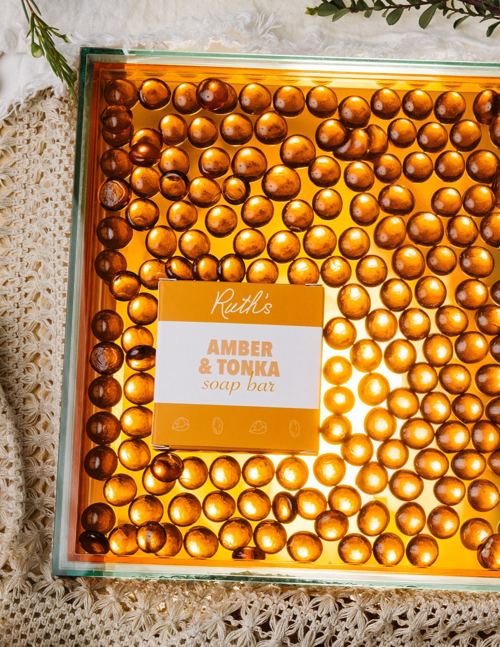 A Lifestyle Image of an Amber & Tonka Soap