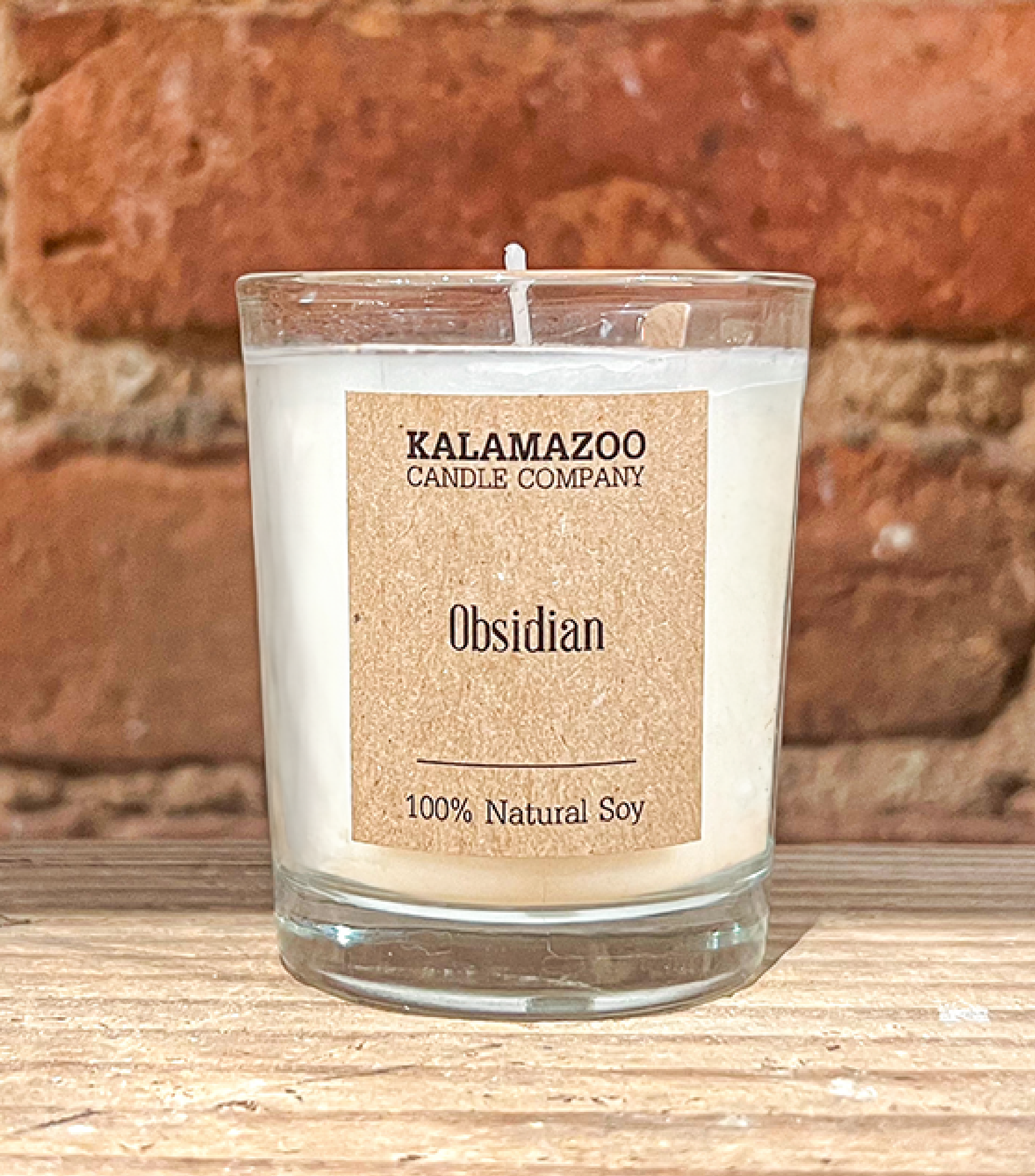 Obsidian Candles Warm island breezes bursting with sugared oranges, lemons, limes and exotic mountain greens, this classic soy candle smells like ripe citrus in a shaded oasis. All Kalamazoo Candles are: 100% natural scented soy wax; produced using locall