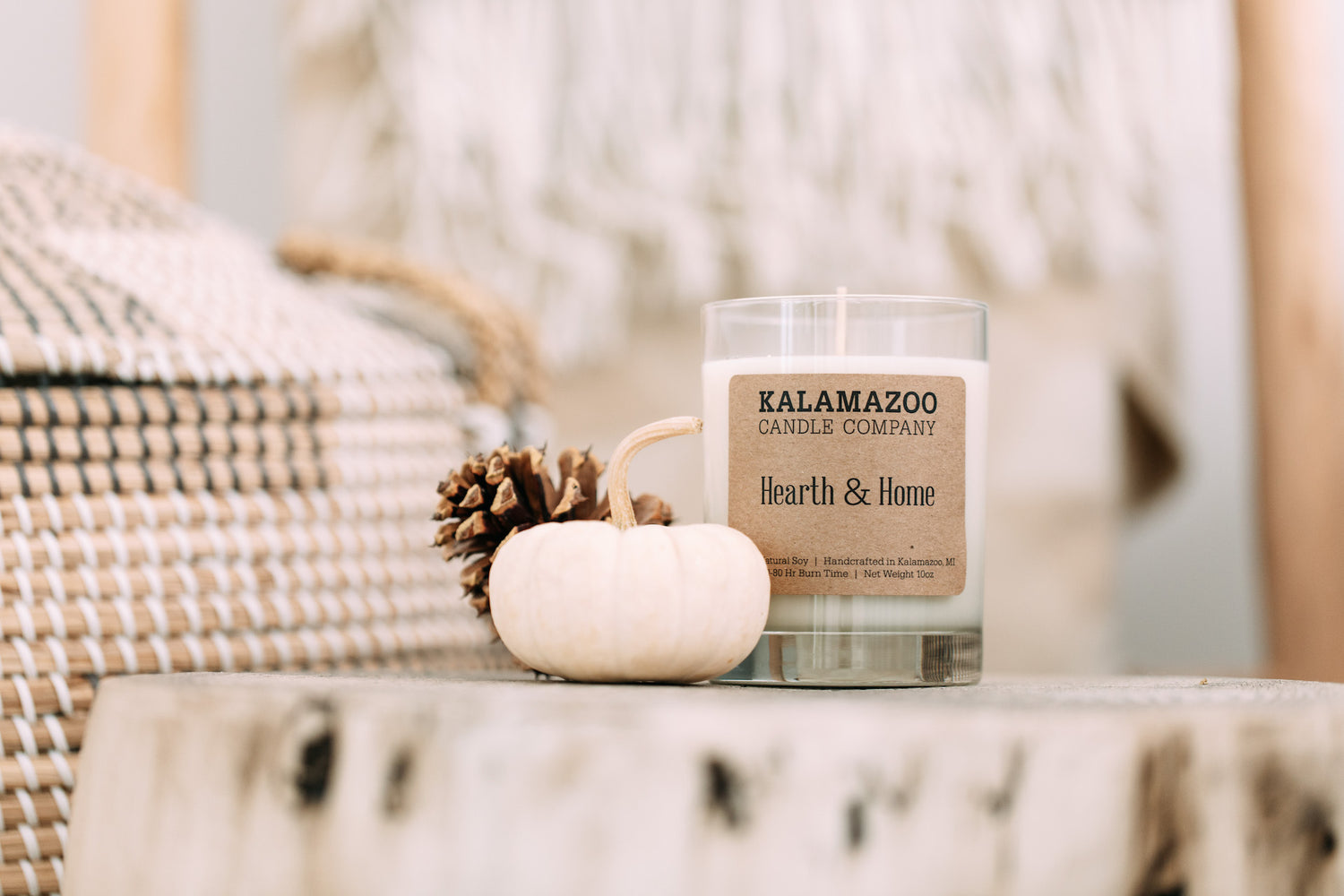 Hearth & Home Candle on a white table.