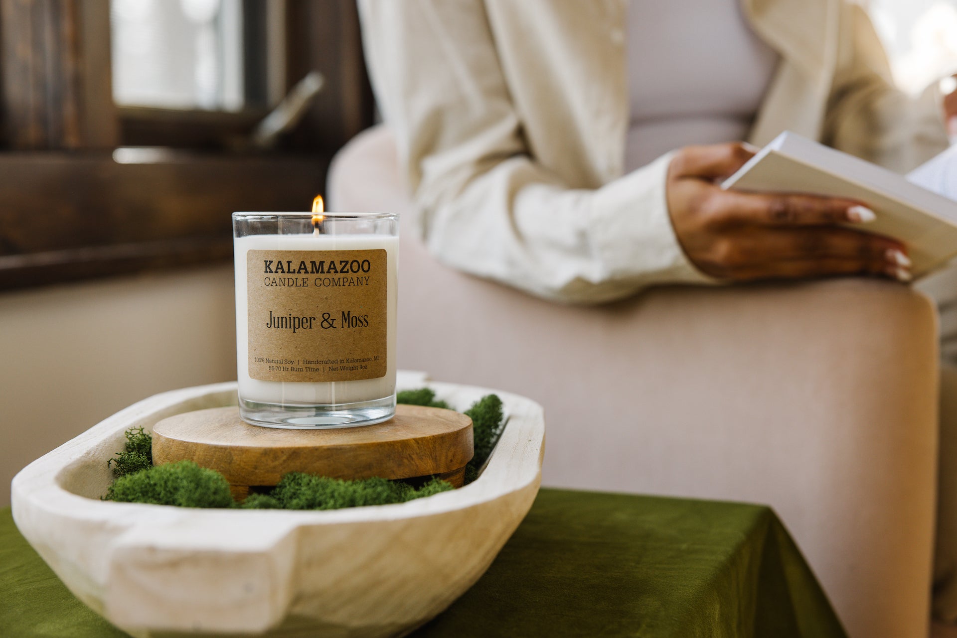 Juniper & Moss Candle on top of moss