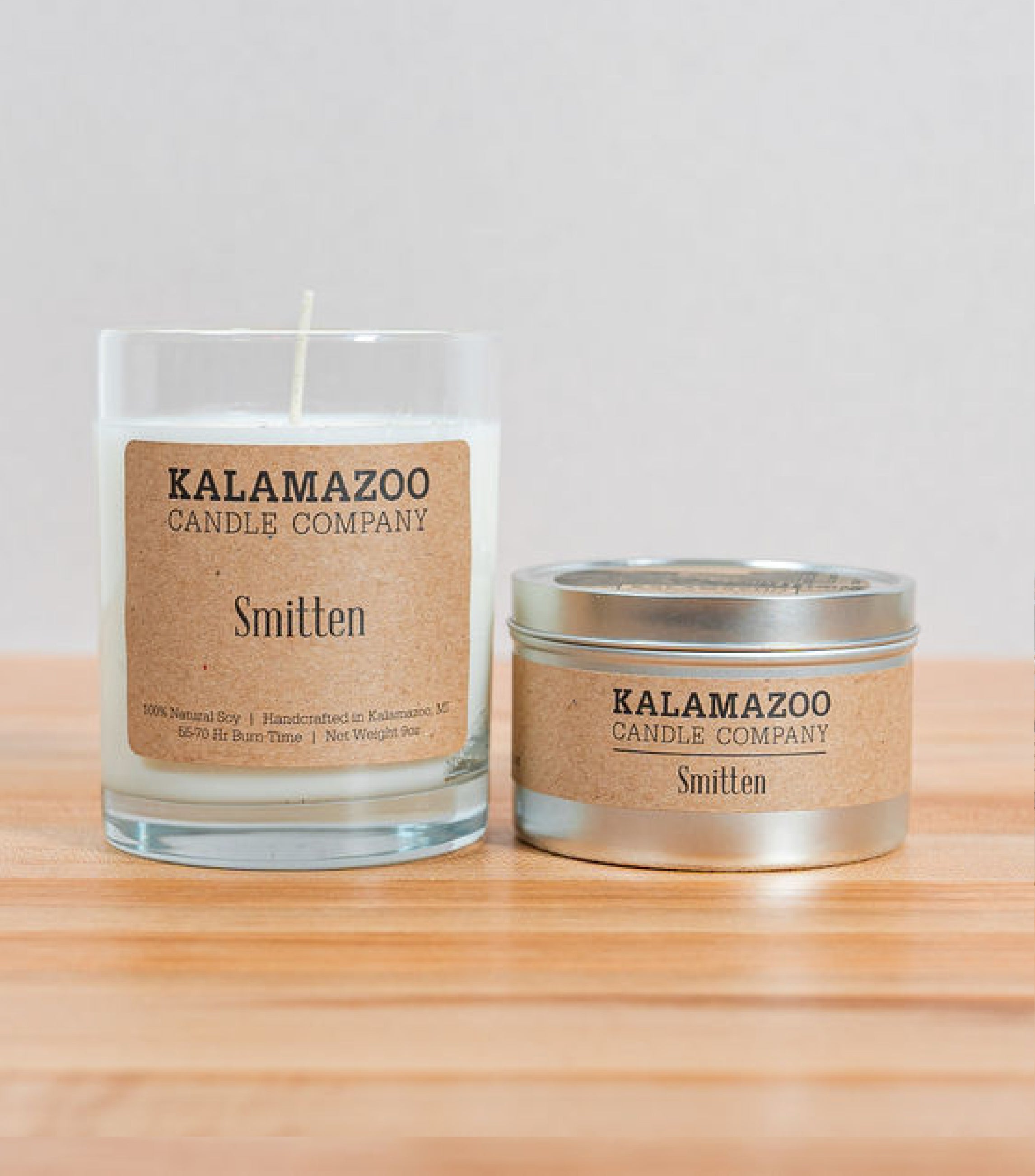 Smitten Candles A soft, sweet blend of floaty florls, sparkling citrus and creamy vanilla, this classic soy candle smells like sunshine daydreams. All Kalamazoo Candles are: 100% natural scented soy wax; produced using locally sourced and American-made ma