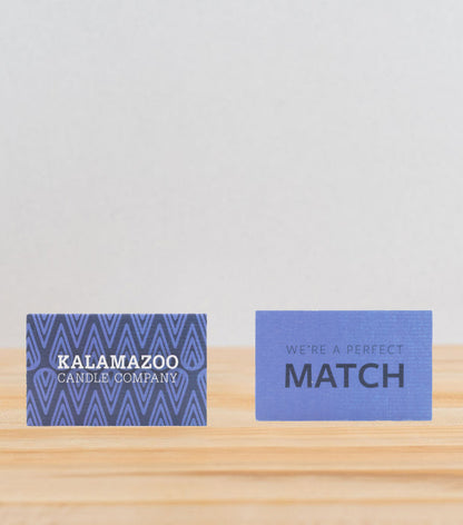 The Front and back of a blue match box.