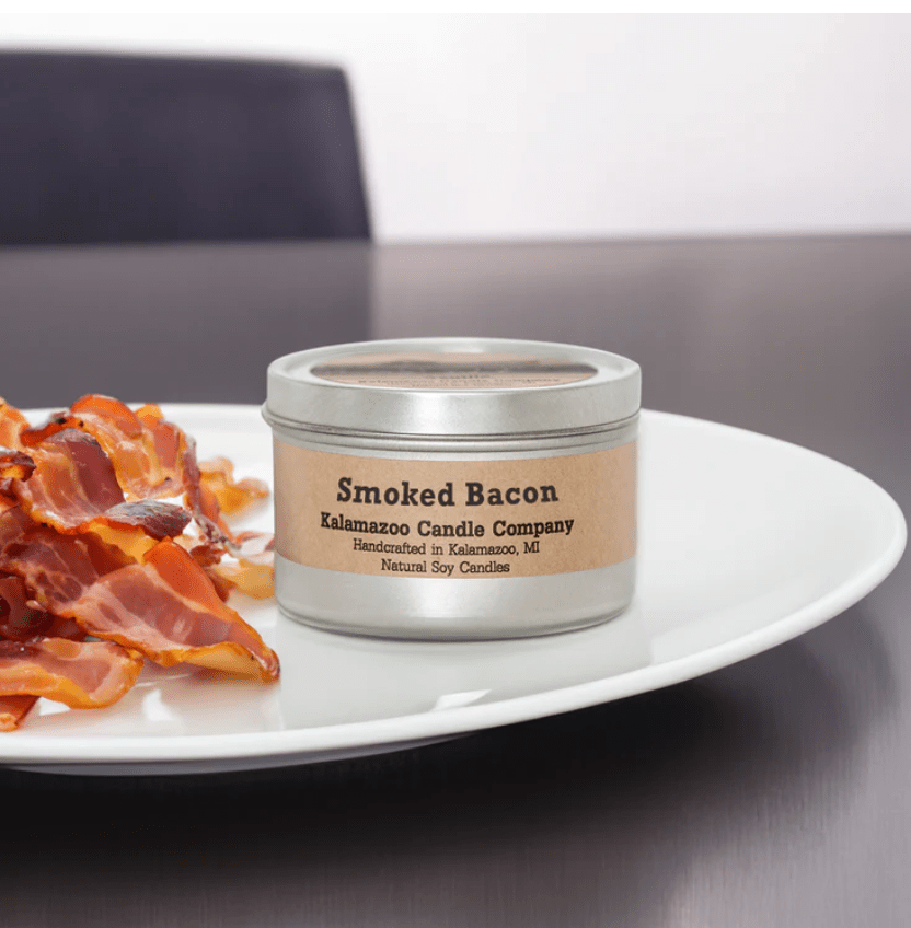 A Smoked Bacon Candle on a plate with bacon