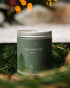 A Large green candle tin with Fir Tree Artwork on the side. Made in Kalamazoo, MI USA. Scented with White Sage, Fresh Pinecones, and Frosted Fir Needles.