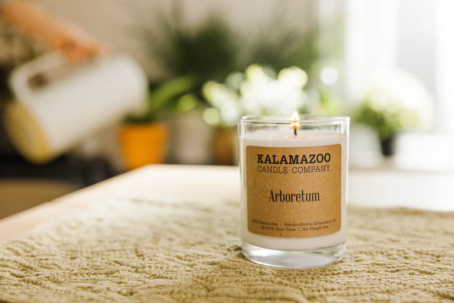 An Arboretum candle with plants