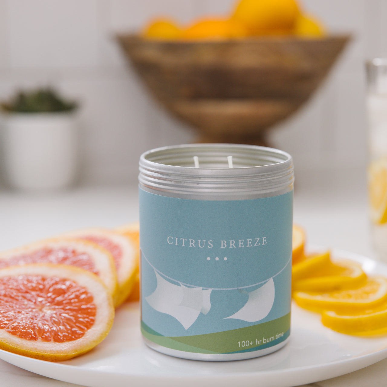 Citrus breeze candle surrounded with grapefruit and lemons