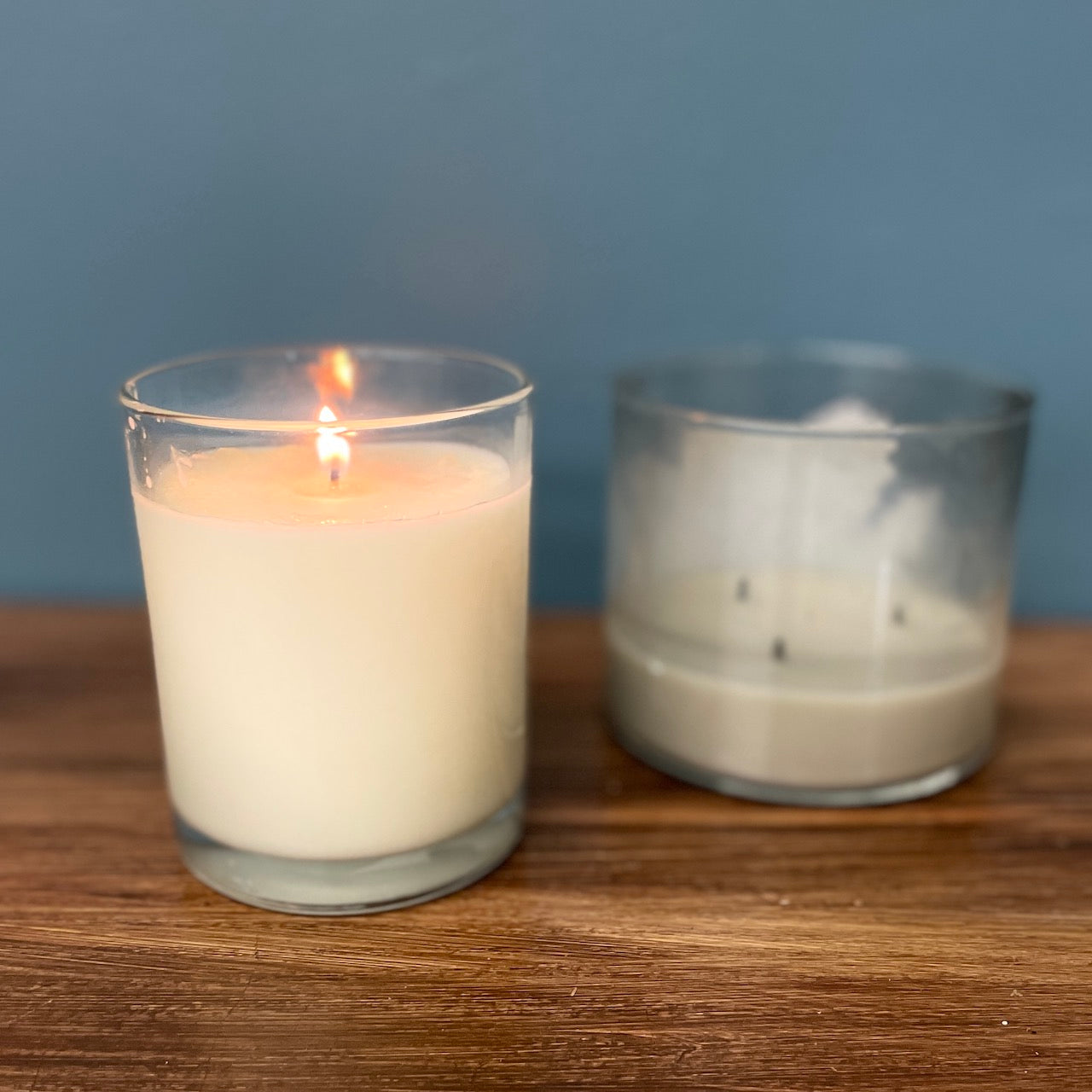 a kalamazoo candle being compared to another candle showing longer burn time
