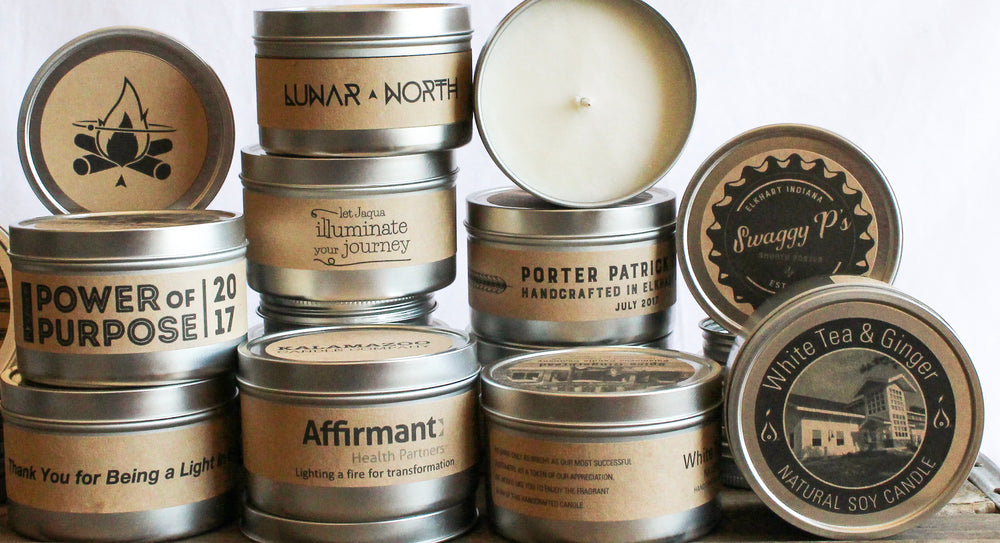 Stack of custom label soy candle tins for businesses and events