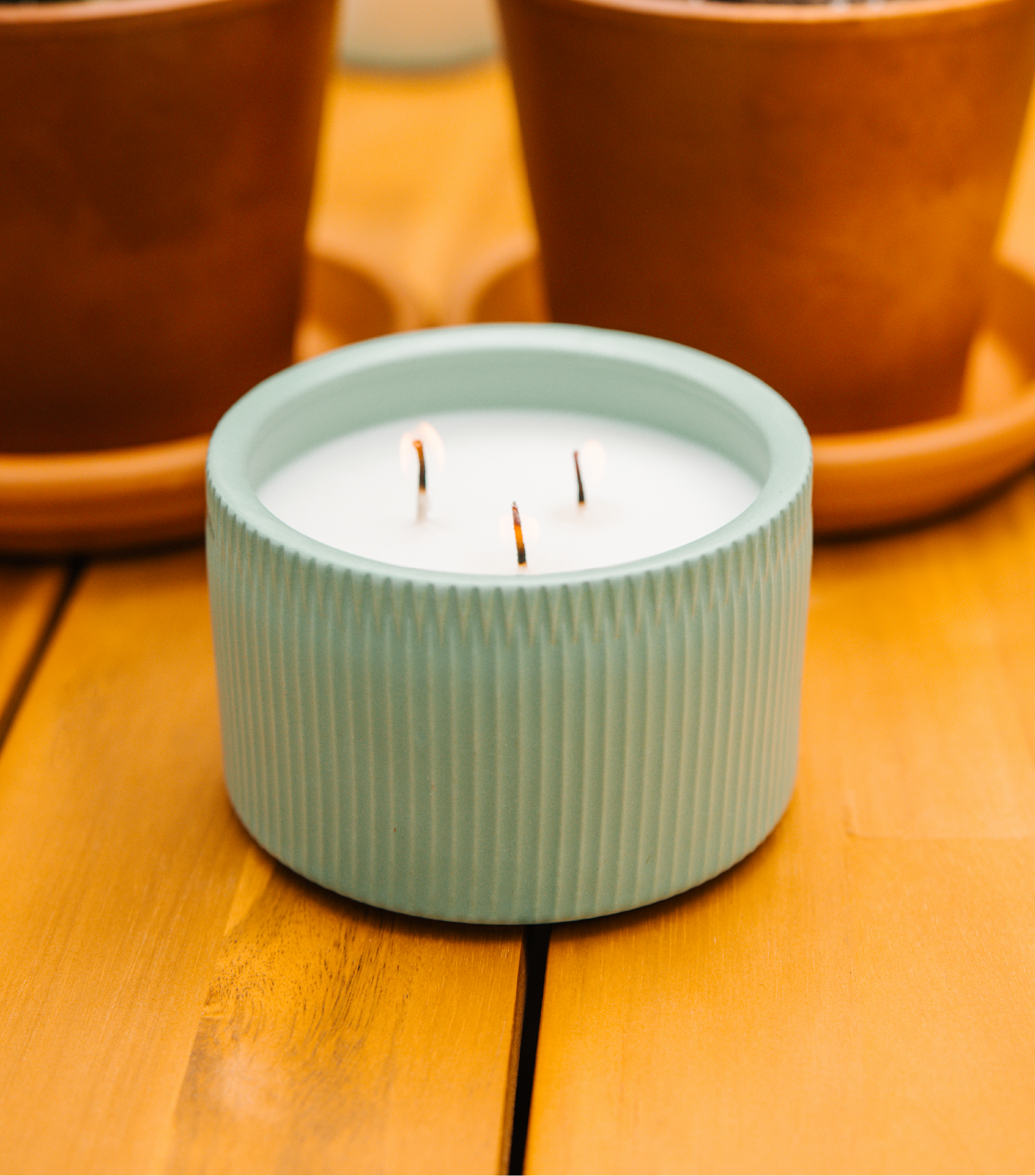 A Light Blue 3-Wick Ceramic Candle scented like Desert Stargaze.