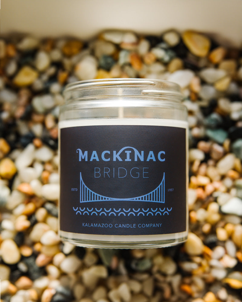 Graphic Mackinac Bridge jar candle filled with fresh bergamot and a relaxing sea salt breeze.