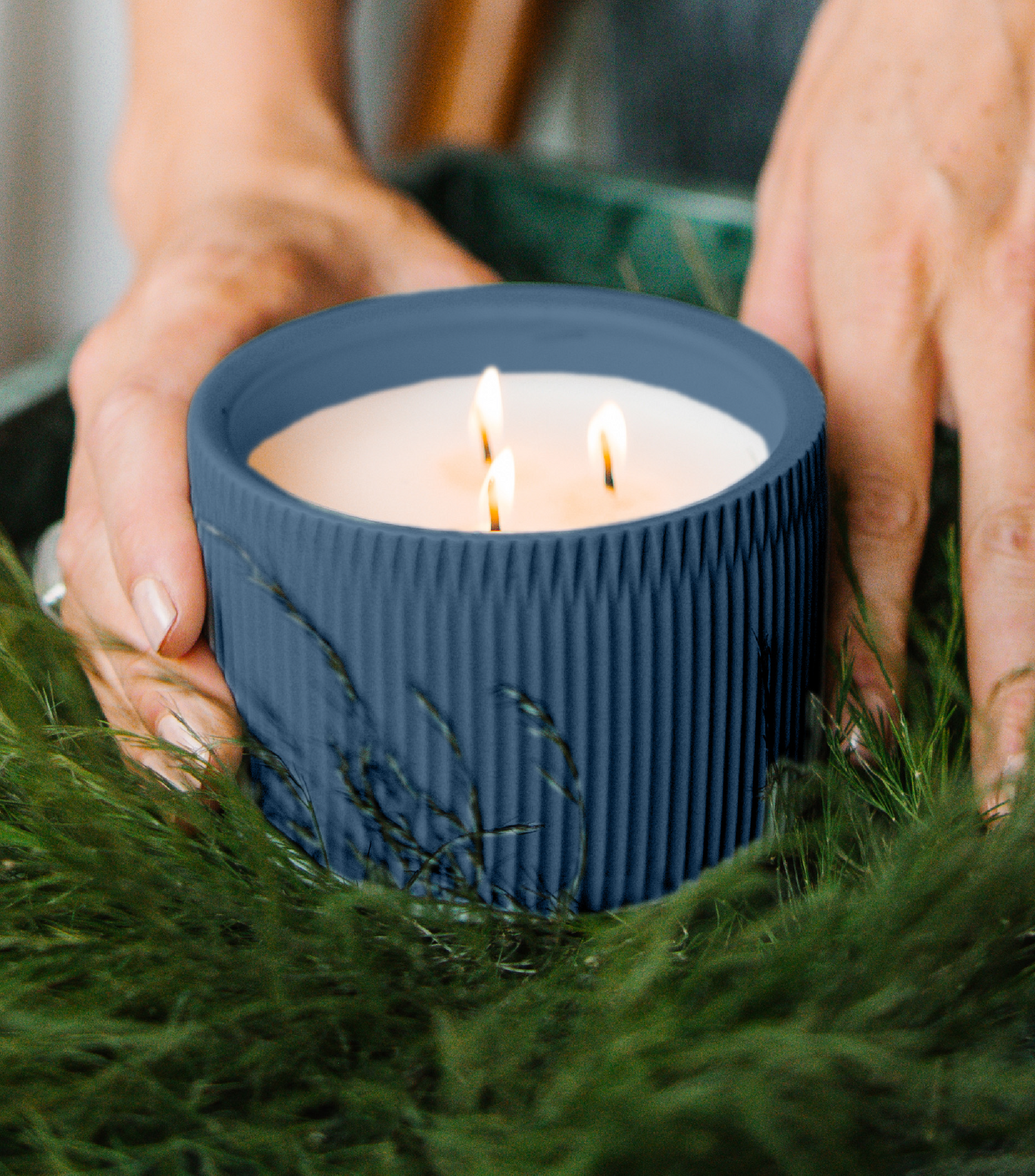 A Dark Blue colored 3-Wick Ceramic Candle scented like River Moss &amp; Teakwood.