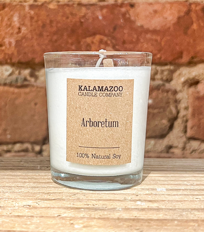 Arboretum Candles This classic soy candle smells like aromatic pine needles and earthy cinnamon brightened with tart Michigan apples. All Kalamazoo Candles are: 100% natural scented soy wax; produced using locally sourced and American-made materials.