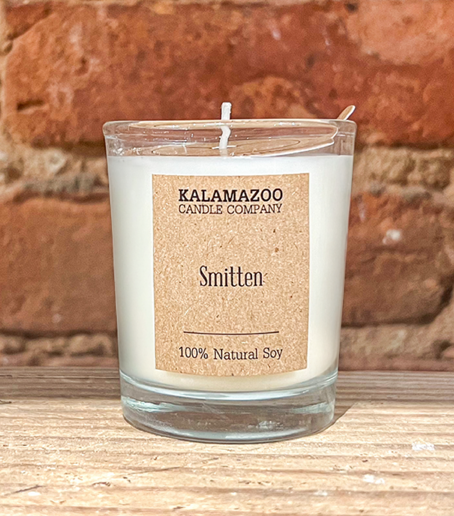 Smitten Candles A soft, sweet blend of floaty florls, sparkling citrus and creamy vanilla, this classic soy candle smells like sunshine daydreams. All Kalamazoo Candles are: 100% natural scented soy wax; produced using locally sourced and American-made ma