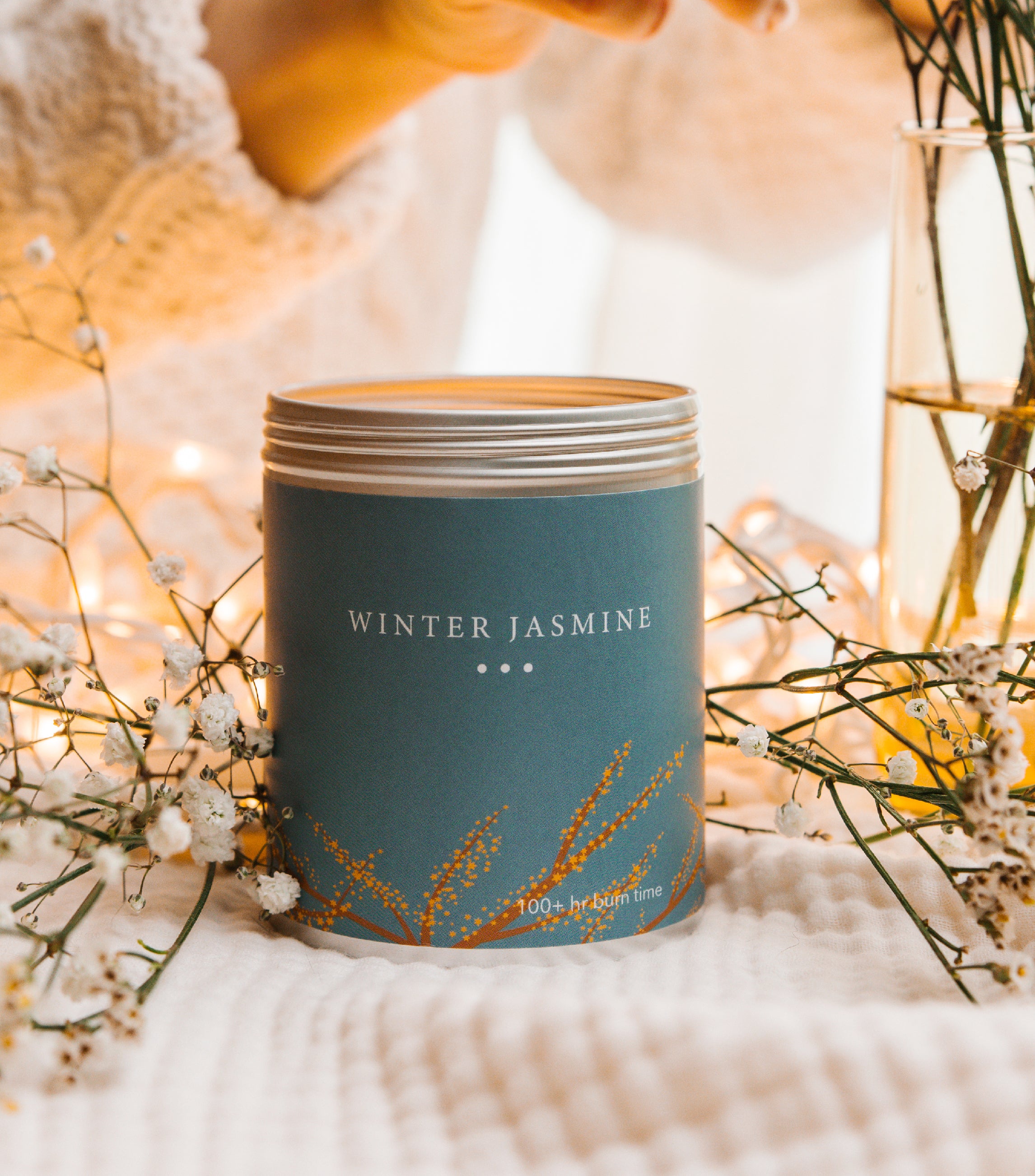 A Large Blue Tin With Jasmine on the sides. Made In The USA In Kalamazoo, MI. Scented with Orange, Frosted Lemon, and Pear Skin.