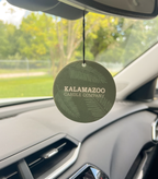 The Back of a Balsam & Cedar Car Freshener hanging in a car.