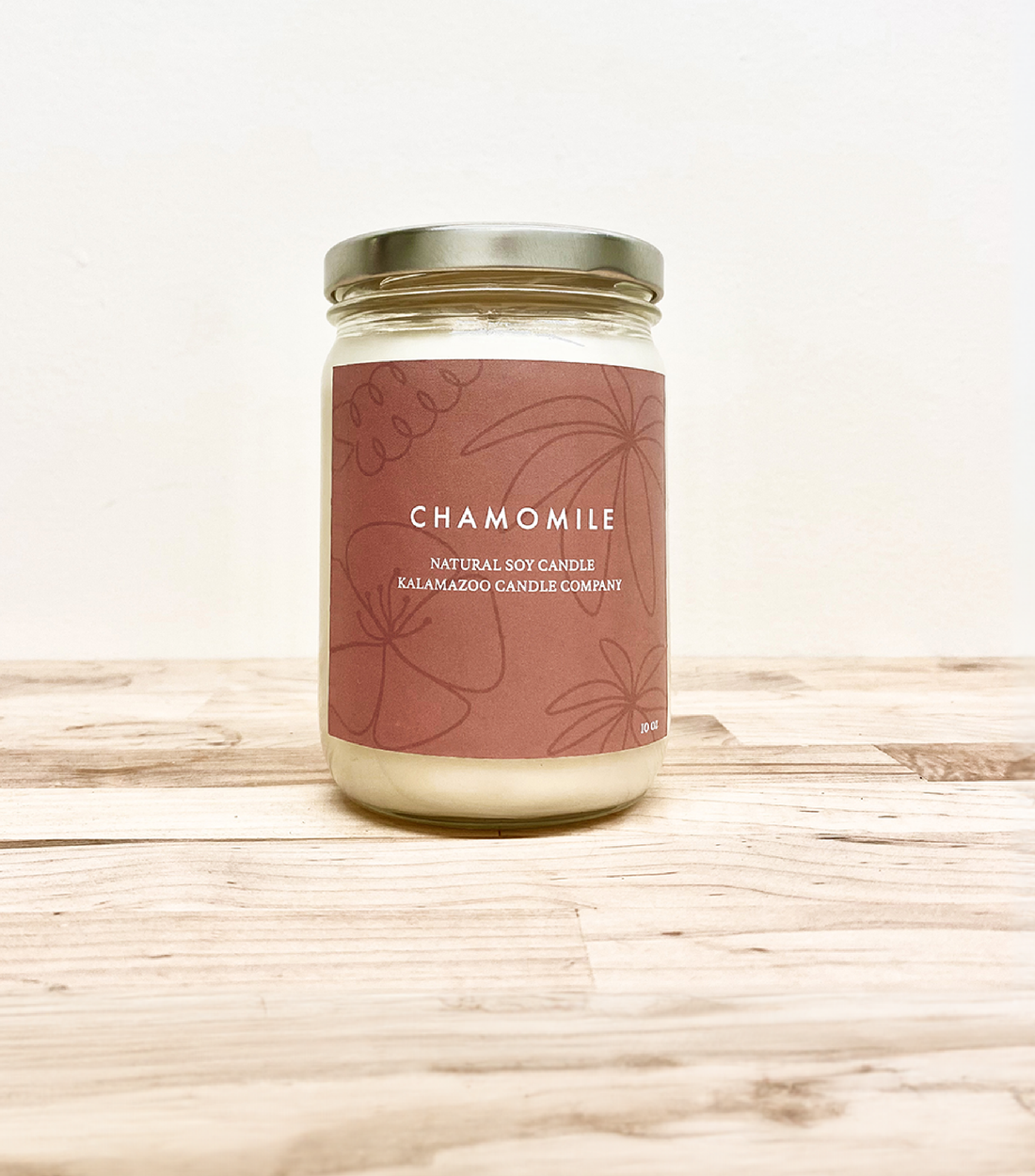 Fragrant chamomile and jasmine fill this candle with a calming essence. Crushed lavender and sparkling orange bring life and vibrance to the room where it slowly burns. Made in Kalamazoo, MI USA.