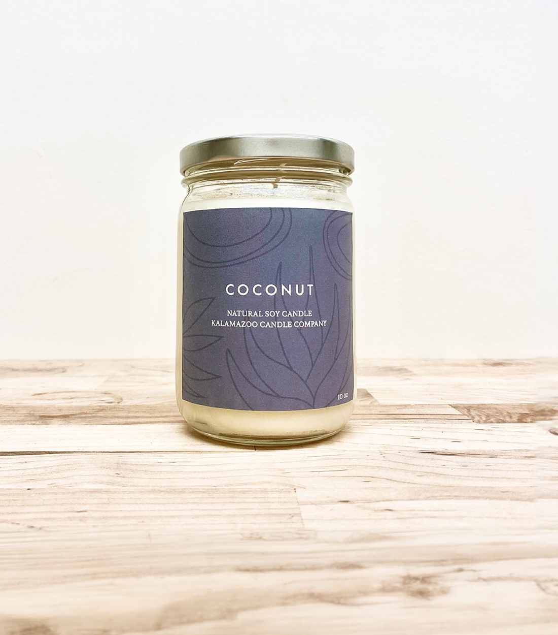 A perfect escape, this candle encapsulates a warm, tropical breeze. Hints of mango nectar and green melon surprise while coconut water refreshes your mind. Made in Kalamazoo, MI USA.