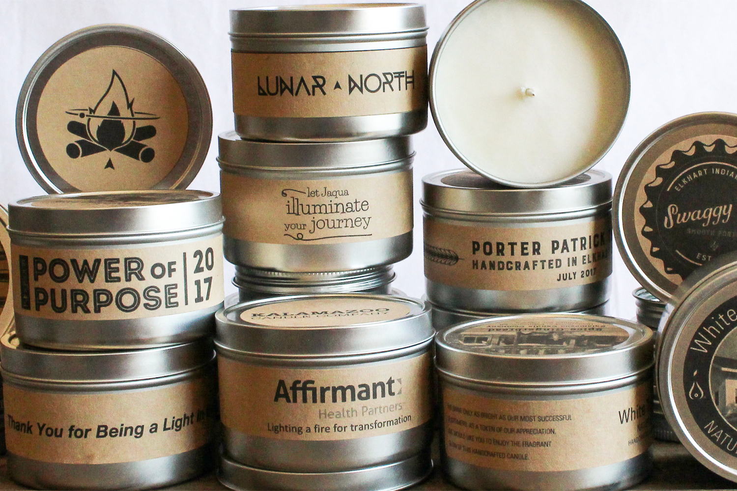 A stack of custom label Kraft candles
