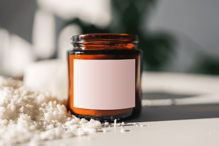 Amber candle jar with a blank label ready for a custom design