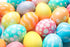 Multicolored, dyed easter eggs with white polka dots, strips or solid colors