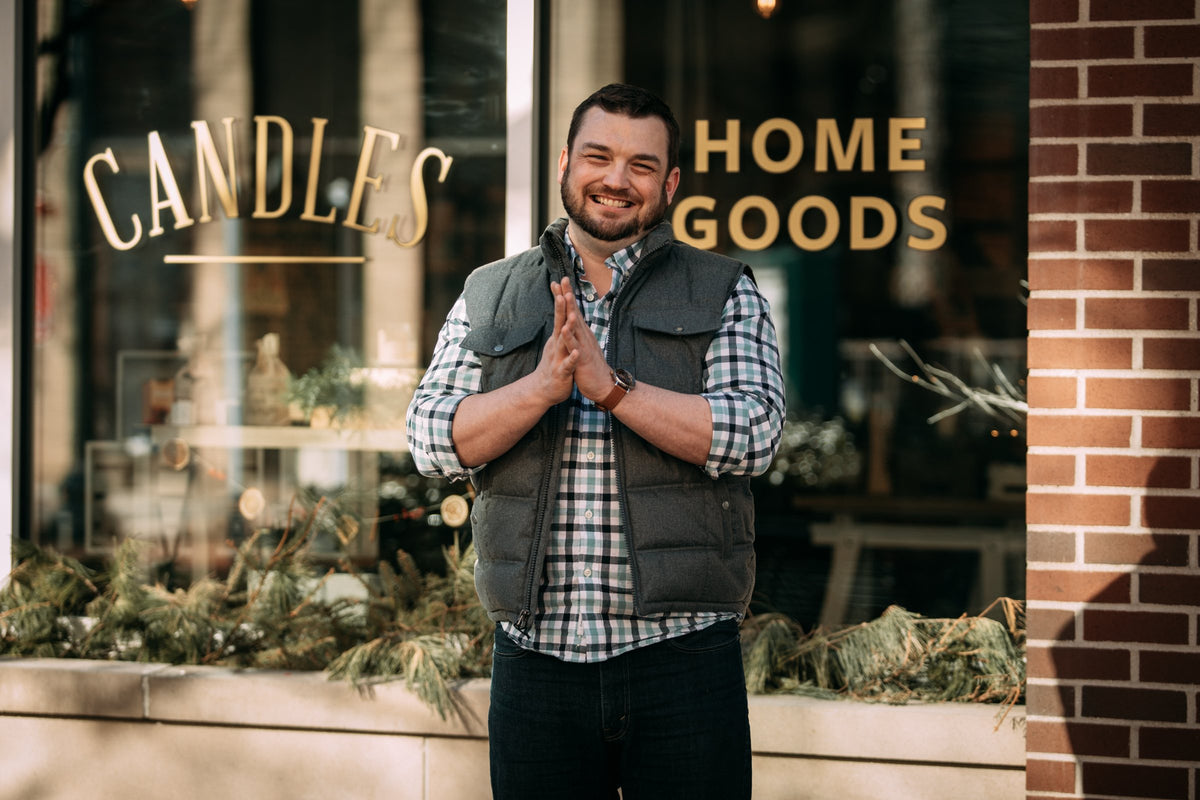 Adam, owner of Kalamazoo Candle Company, outside the downtown Kalamazoo candle shop