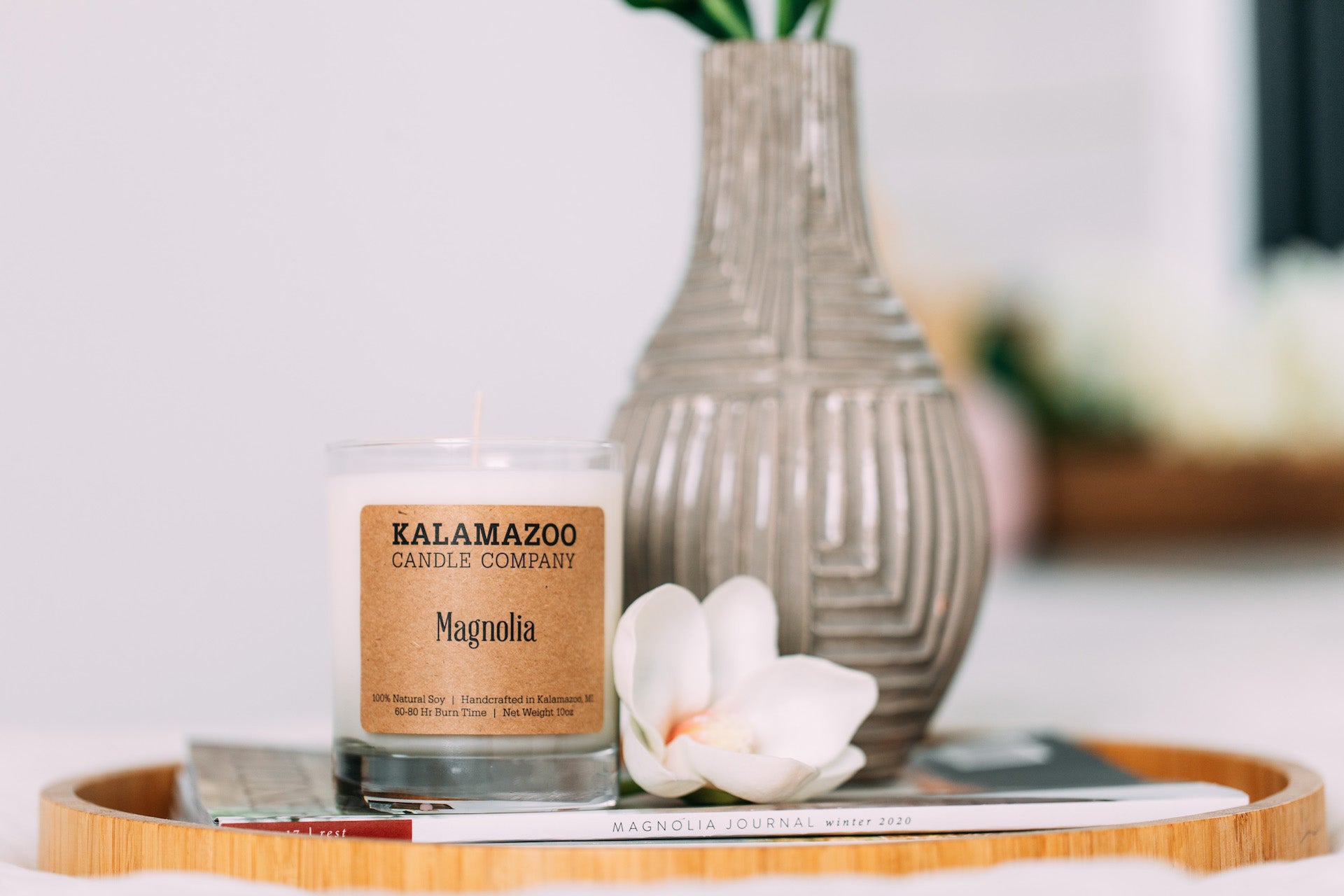 Magnolia Candle next to a magnolia