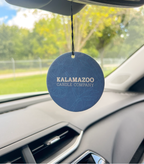 The Back of an Obsidian Car Freshener hanging in a car.