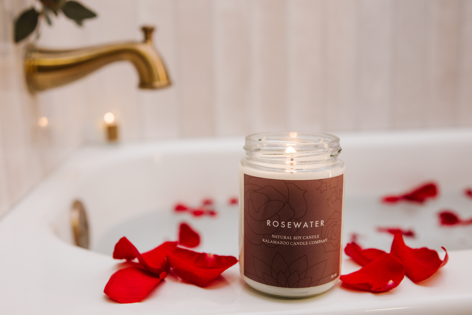 Rosewater Candle next to a bath of rosewater