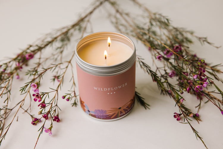 A large Pink candle called "Wildflower" directing people to Large 2-Wick Candles