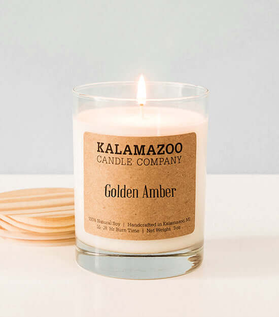 Golden Amber Candles Warm, rich, and welcoming, ancient resins and exotic woods are brightened by golden citrus in this soy candle with notes of amber, vanilla, and orange zest. All Kalamazoo Candles are: 100% natural scented soy wax; produced using local