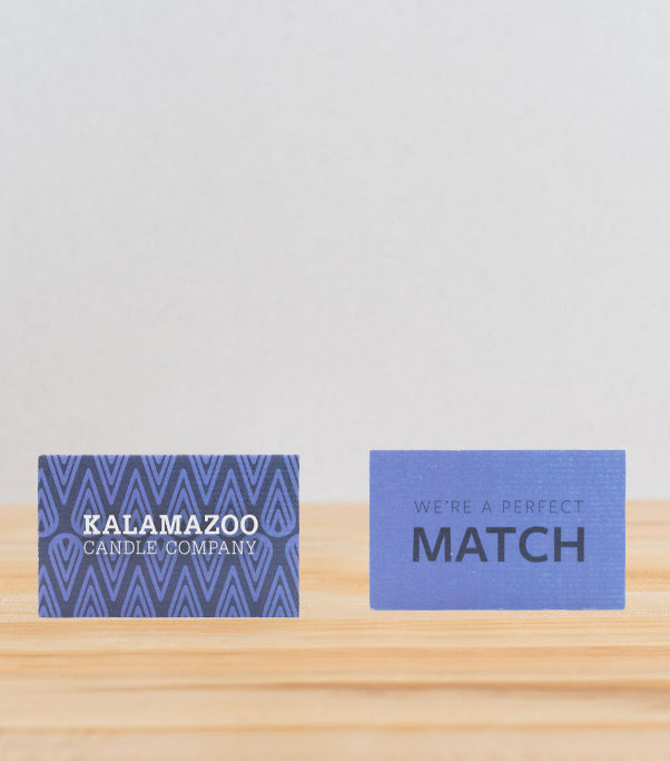 The Front and back of a blue match box.