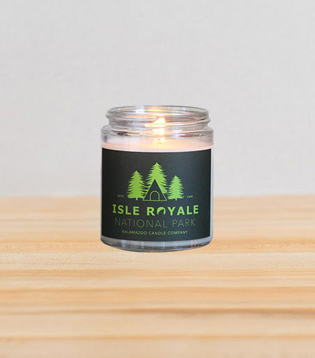 Graphic Isle Royal National Park jar candle filled with sunny eucalyptus infused with bright bergamot and rich cedarwood to clear your mind and soothe your senses.
