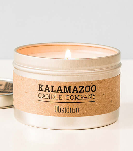 Obsidian Candles Warm island breezes bursting with sugared oranges, lemons, limes and exotic mountain greens, this classic soy candle smells like ripe citrus in a shaded oasis. All Kalamazoo Candles are: 100% natural scented soy wax; produced using locall